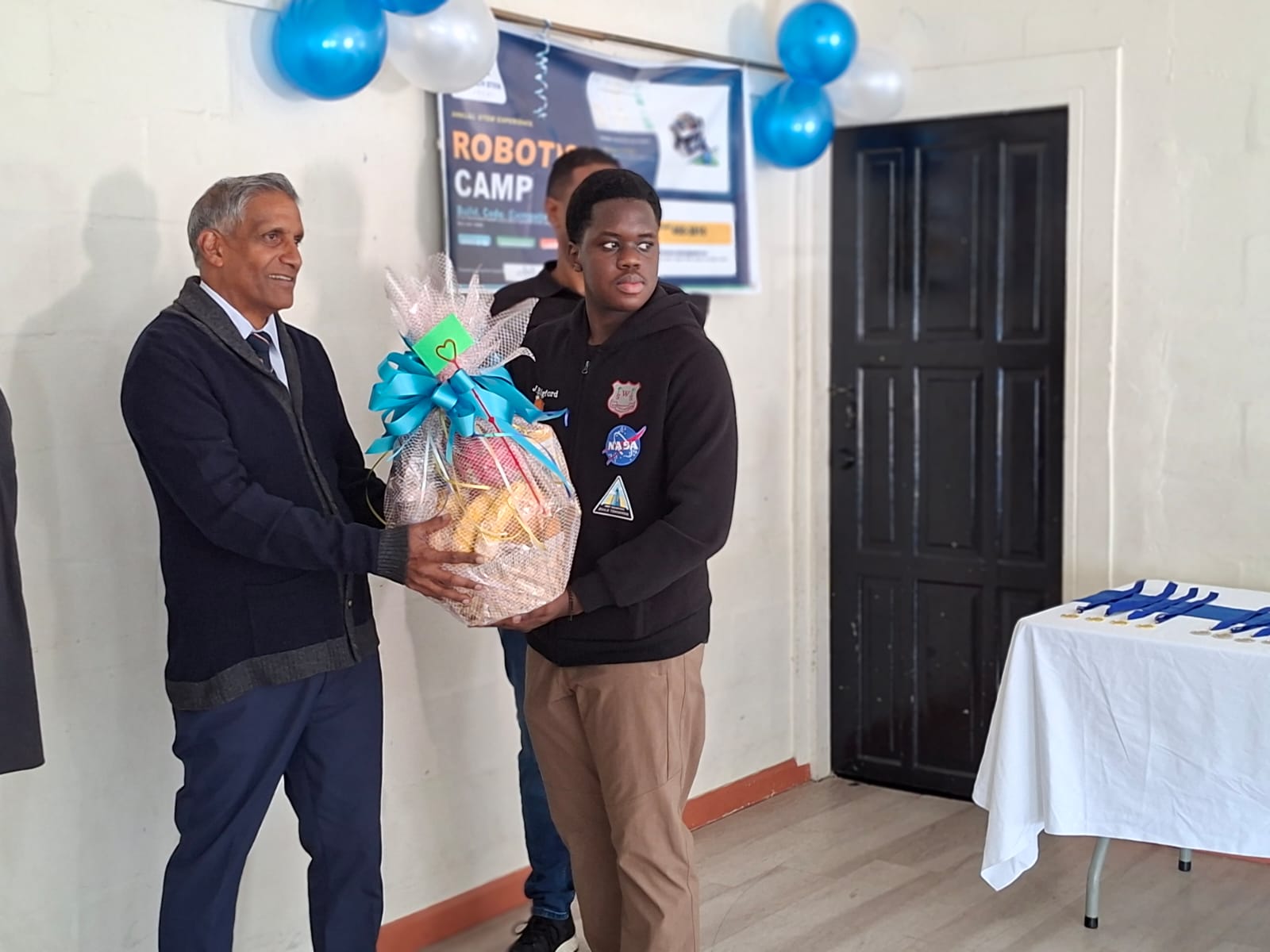 Student presenting a robot during the camp celebration